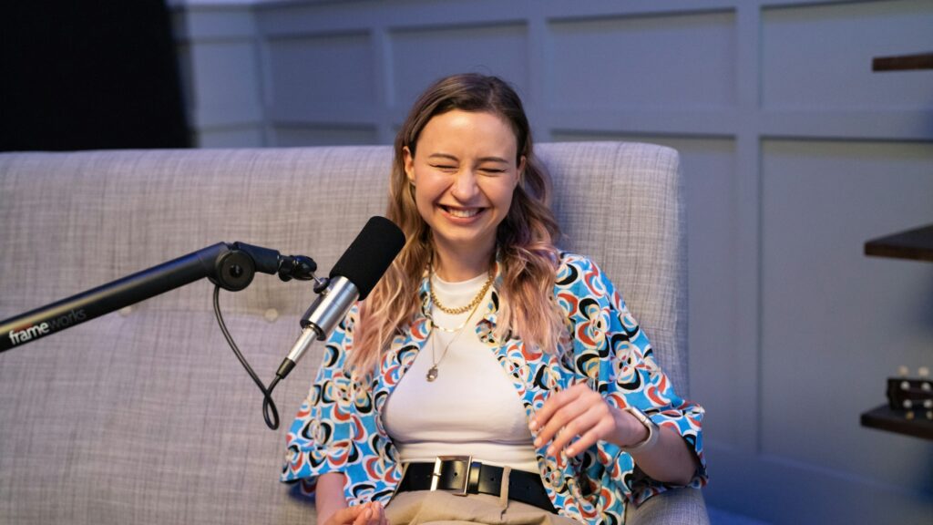 Woman laughing on podcast