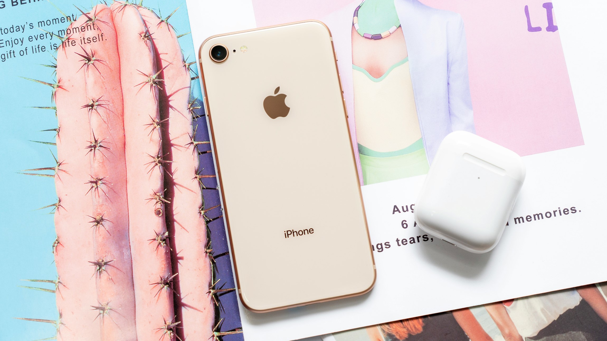 Apple iPhone Rose-gold with Airpods