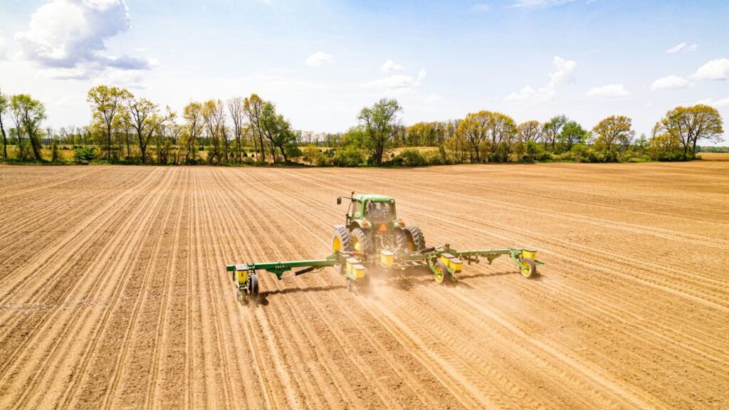 Tractor driving on farm land